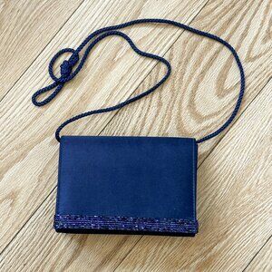 8.	Navy Blue-color satiny fabric, small dressy should bag with bead trim